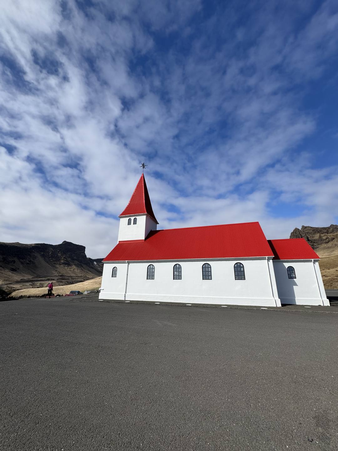 The red-roofed white church above Vik i Myrdal, the southernmost village on the Iceland South Coast route